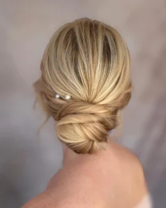 13. classic low bun with pearl detail on honey blonde bun hairstyles (1)