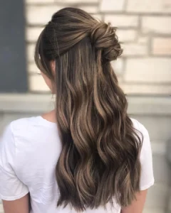13. mocha swirl half up knot with flowing waves top knot hairstyles