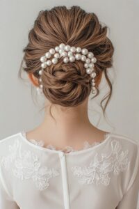 braided low bun with statement pearl headpiece