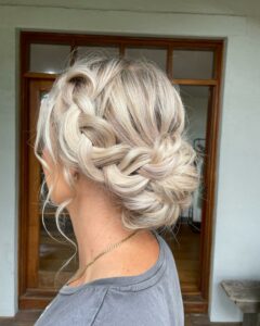 image of braided side bun for medium length hair inspired by side bun hairstyles 1229x1536