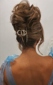 romantic textured updo with statement hair accessory 570x905