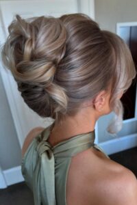 soft twisted low updo with romantic texture for prom wedding