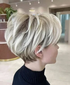 a super cool icy blonde layered pixie bob with darker root is a cool idea to get volume movement and texture at the same time 734x892