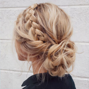 15 Dreamy Boho Braids for Festival Season messy bun with an accent side braid
