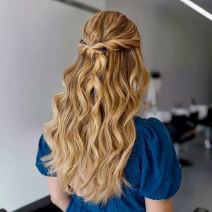 soft twisted half down prom style with loose curls