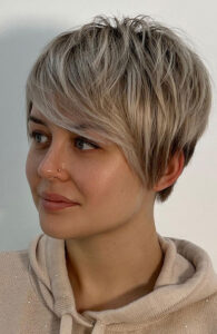 textured silver blonde pixie side swept fringe