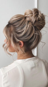 high bun with face framing pieces