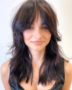 long wolf cut with curtain bangs
