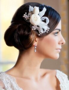 elegant updo with a headpiece or fascinator