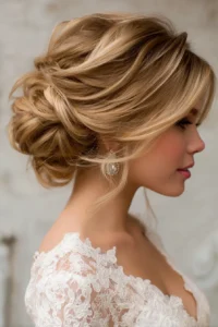 textured updo with face framing pieces